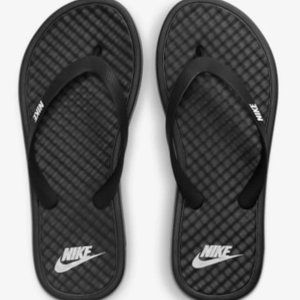 Nike flip-flops - black and white - woman's size 9